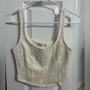 Cropped Altar’d State tank top.